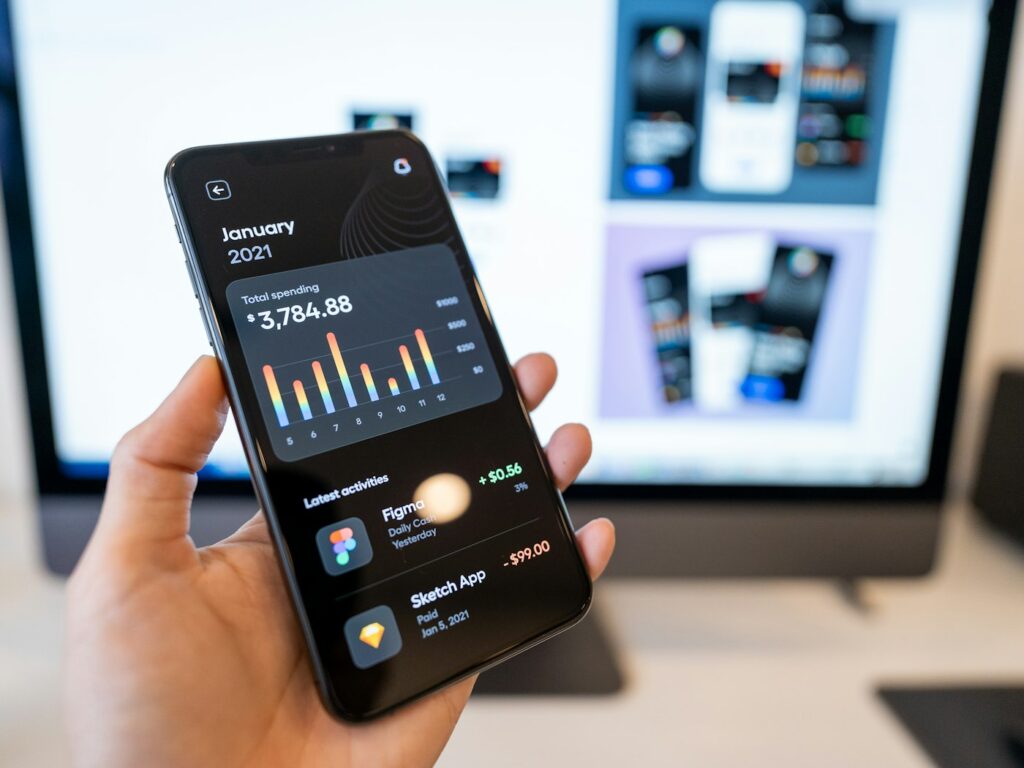Nordvik Bank case study: hand holding a smartphone showing an app